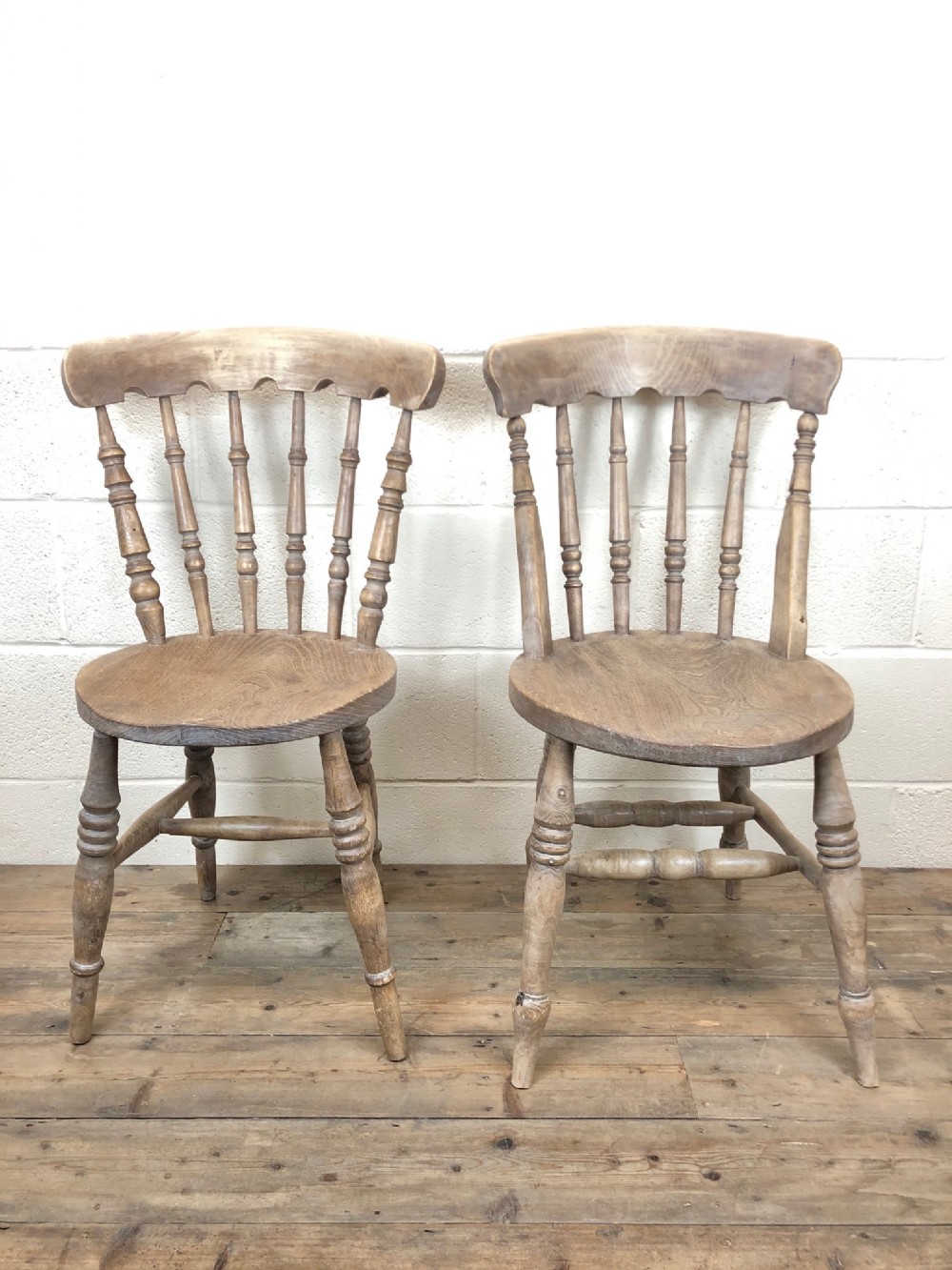 Two Similar Antique Ash and Elm Country Chairs with Penny Seats