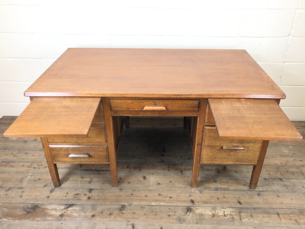 Early 20th Century Oak Desk with Six Drawers View VIII