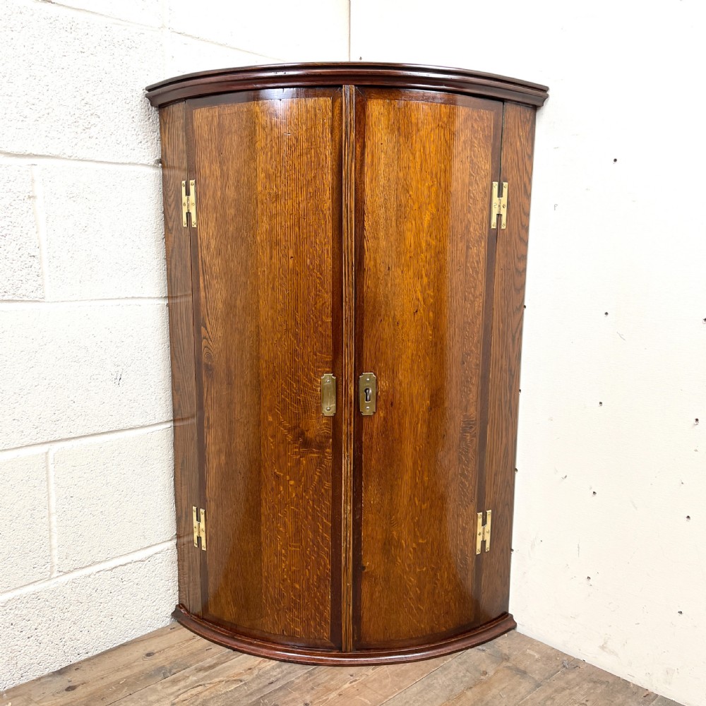 Georgian Oak Bow front Corner Cupboard