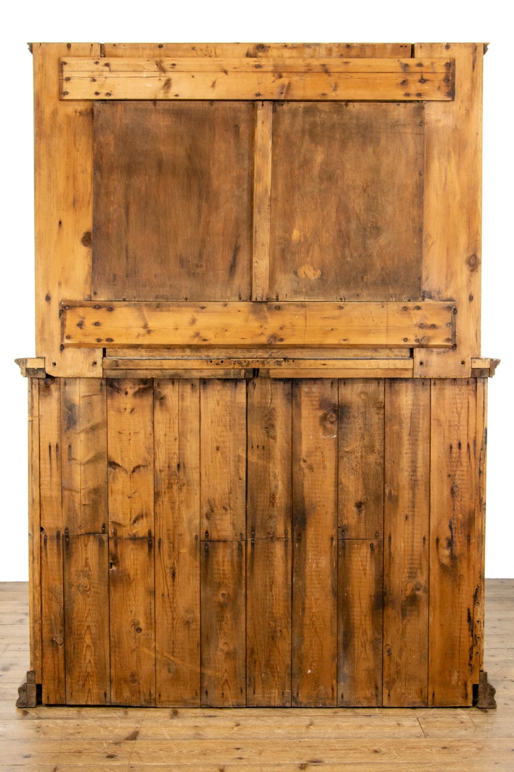 A light oak and pine sideboard featuring a raised mirror back with turned columns, two upper drawers, and a two-door lower cupboard. View X
