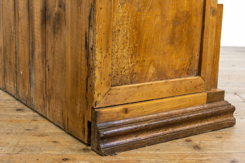 A light oak and pine sideboard featuring a raised mirror back with turned columns, two upper drawers, and a two-door lower cupboard. View XI