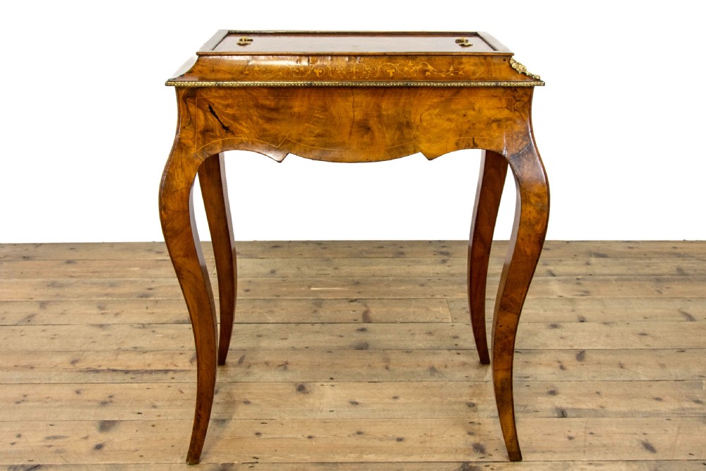 An antique French Rococo style burr walnut jardiniere table with decorative marquetry inlay on the lid, brass mounts, and slender cabriole legs. View VII