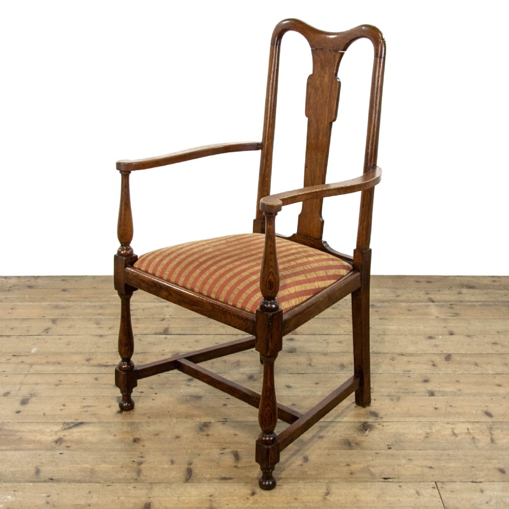 A pair of antique oak armchairs featuring shaped splat backs, curved armrests, turned legs, and red striped upholstered seats. View IV