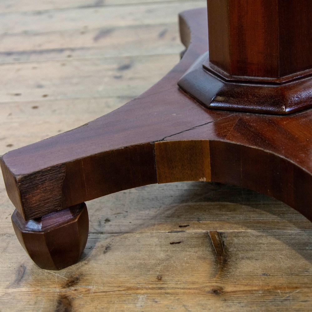 A dark brown mahogany side table featuring a rectangular top with geometric timber inlay, a central octagonal column, and a four-pointed pedestal base. View VIII