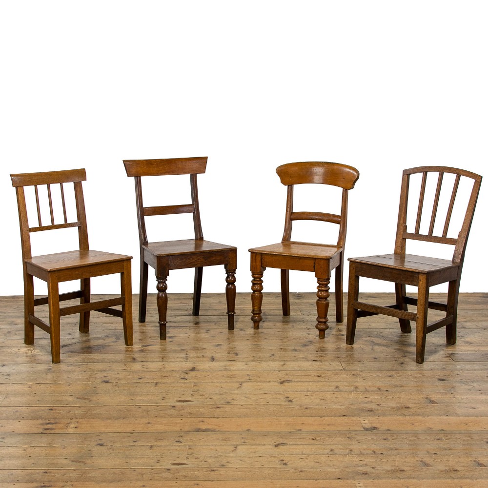 Harlequin Set of Four Antique Oak Farmhouse Chairs