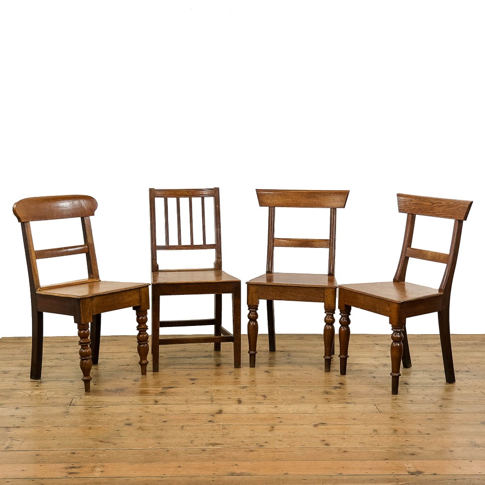 Harlequin Set of Four Antique Oak Farmhouse Chairs