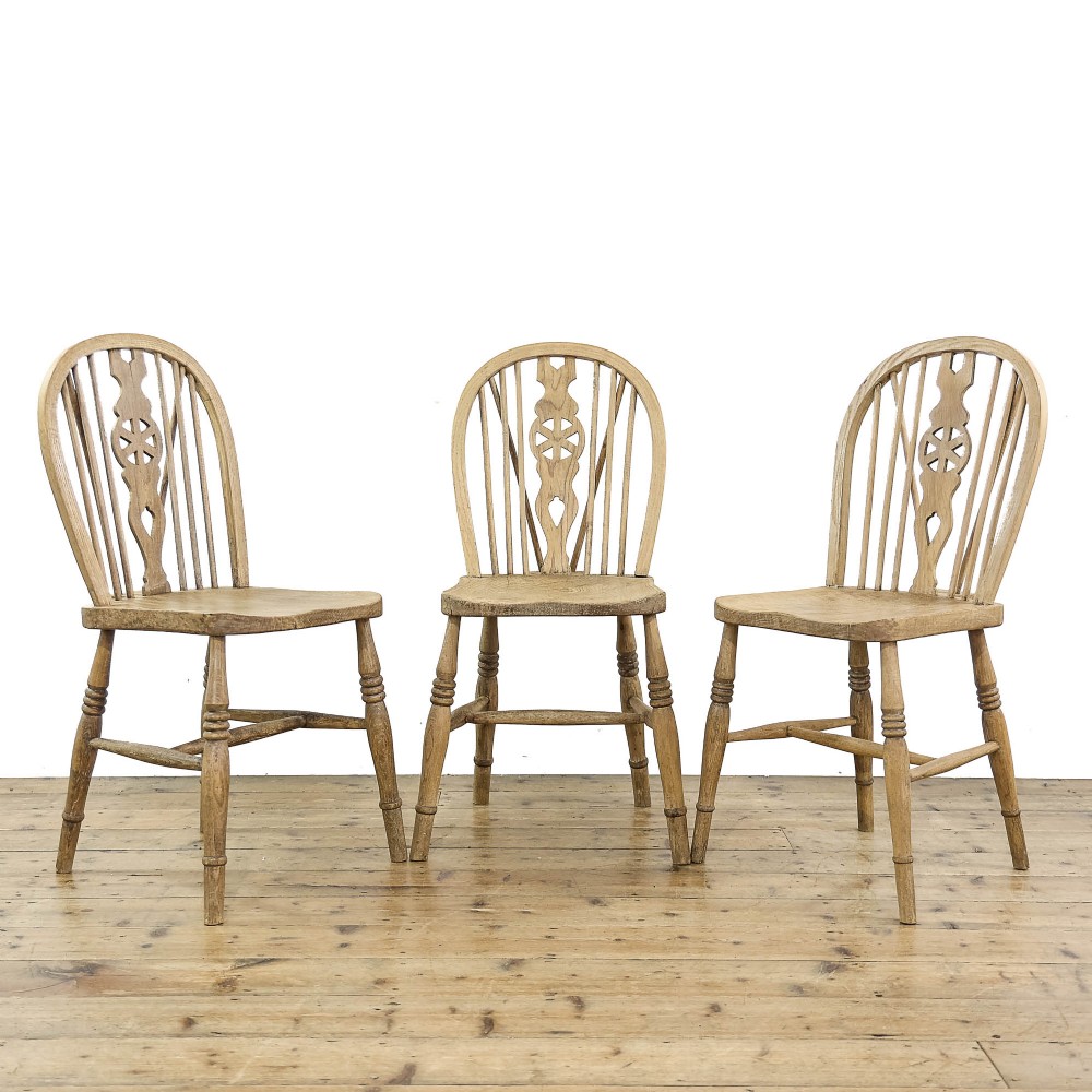 Three Antique Pine Wheelback Kitchen Chairs

