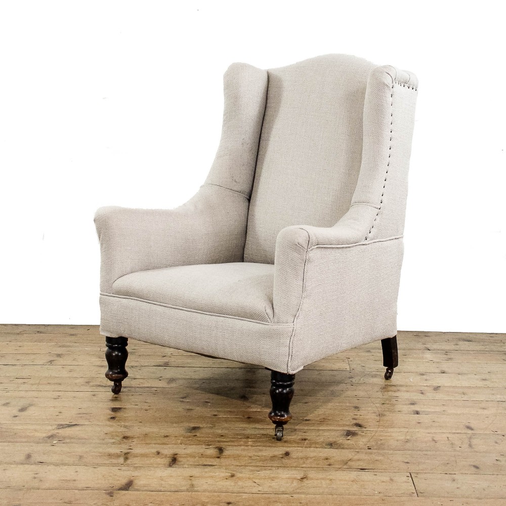 Antique Upholstered Cream Wing Back Armchair