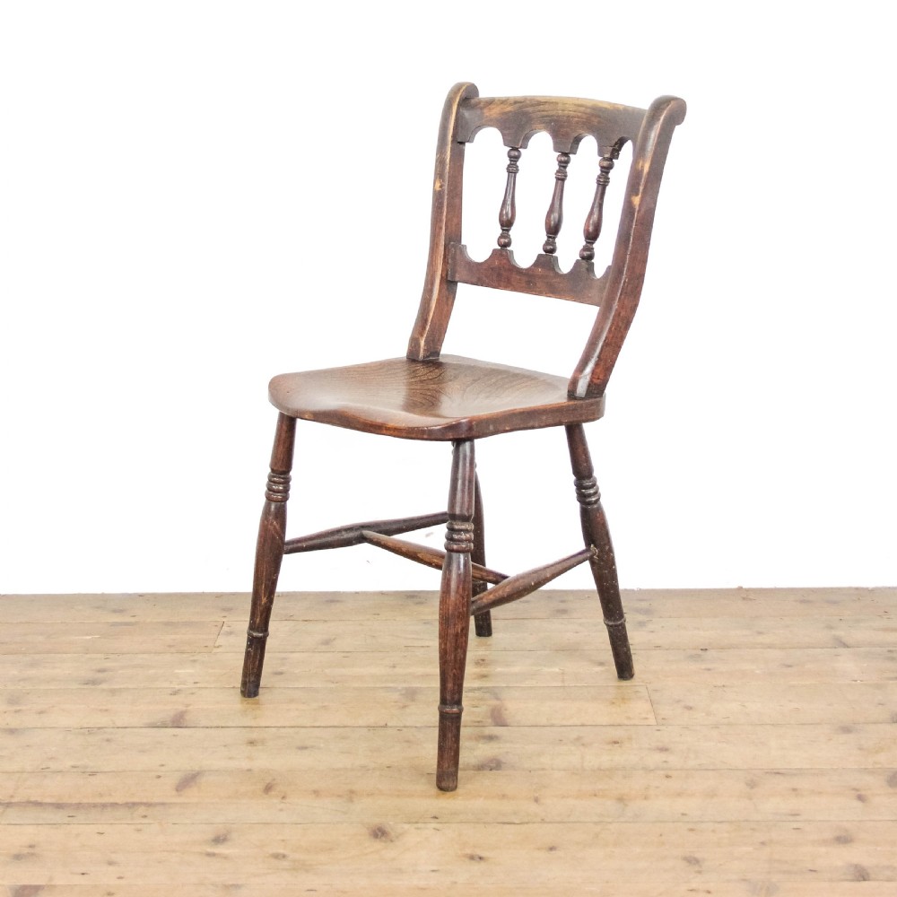 A set of three Victorian elm farmhouse dining chairs featuring shaped seats, turned spindles, and dark timber finishes. View IV