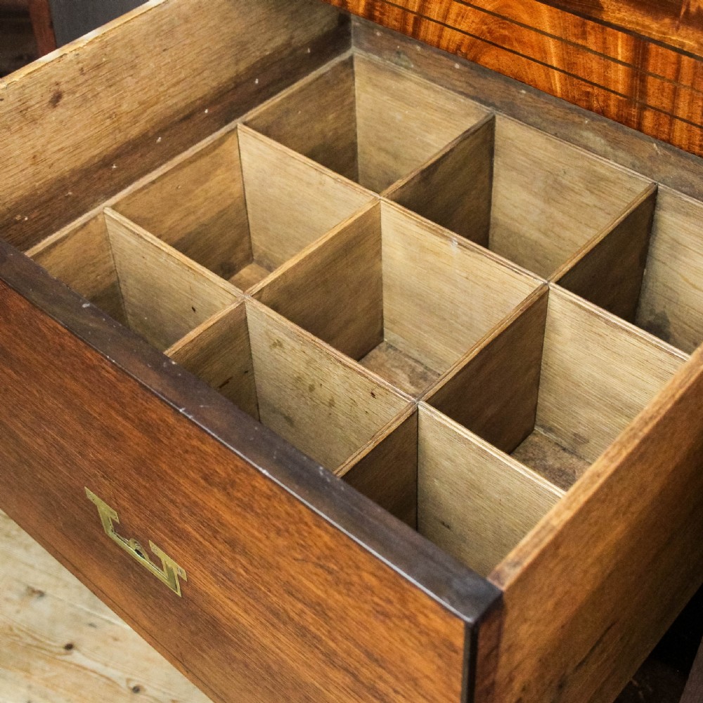 A pair of matching 19th-century mahogany side cabinets with flame mahogany door panels, single upper drawers, and shaped bracket feet. View VI