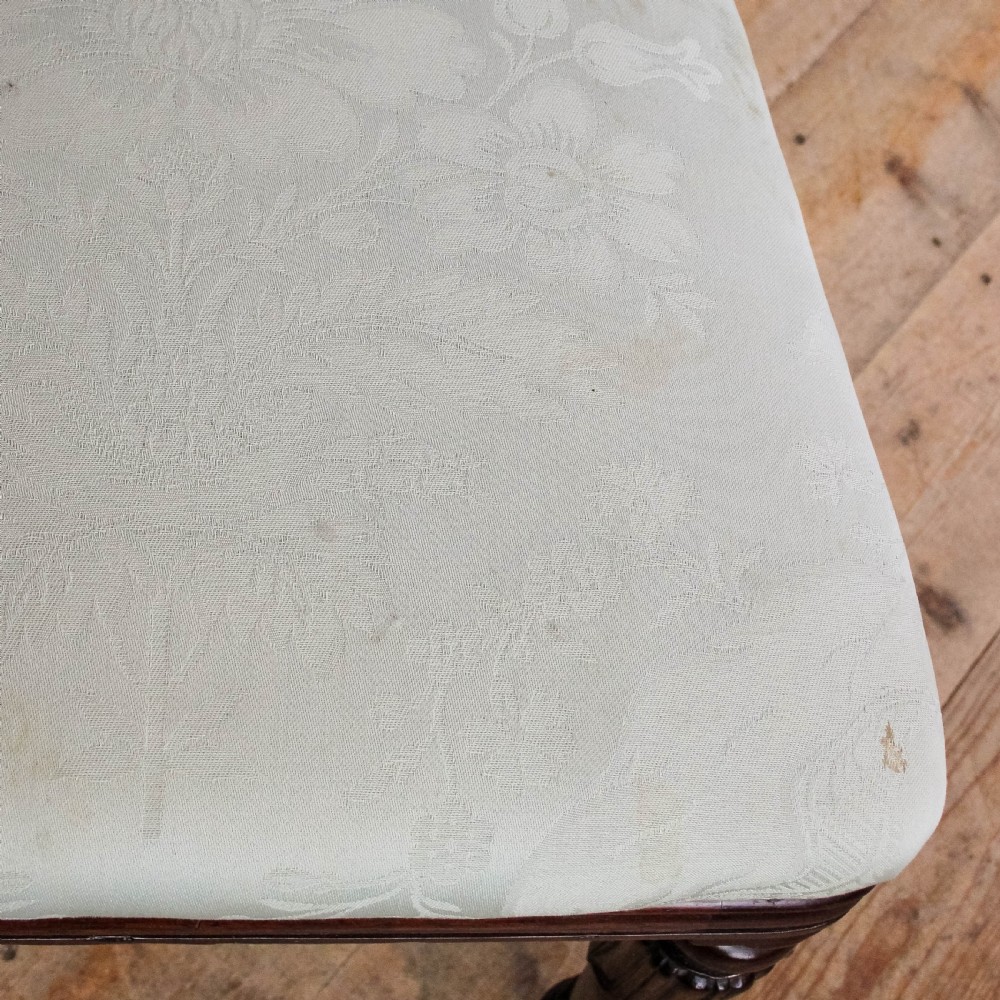 A set of six Victorian mahogany dining chairs with carved scroll backrests and pale green fabric seats. View IV