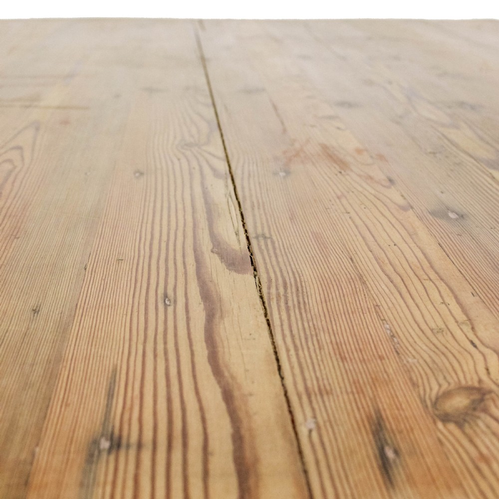 A large antique pine farmhouse kitchen table featuring a plank top, turned legs, and a single frieze drawer with a wooden knob. View VIII