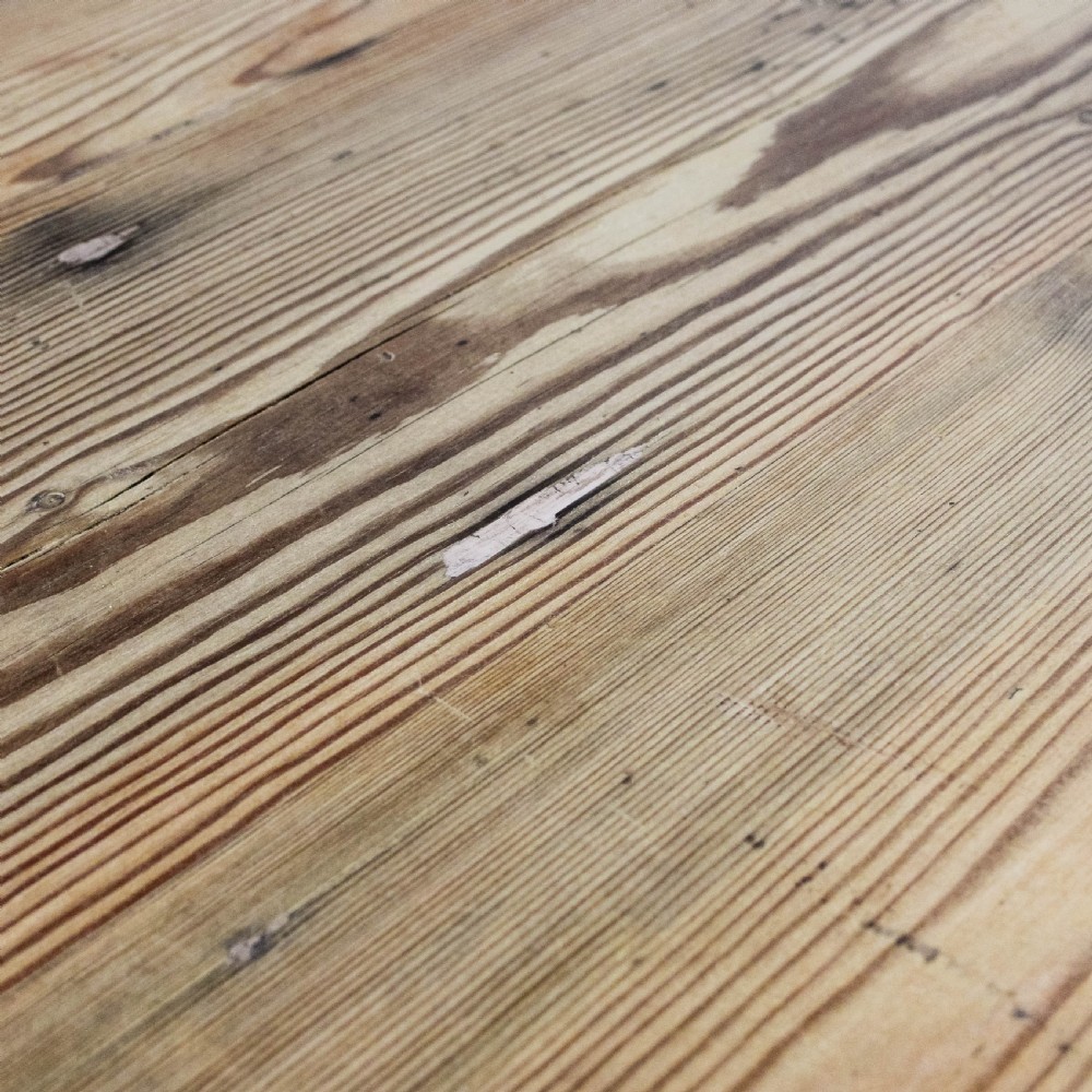 A large antique pine farmhouse kitchen table featuring a plank top, turned legs, and a single frieze drawer with a wooden knob. View IX