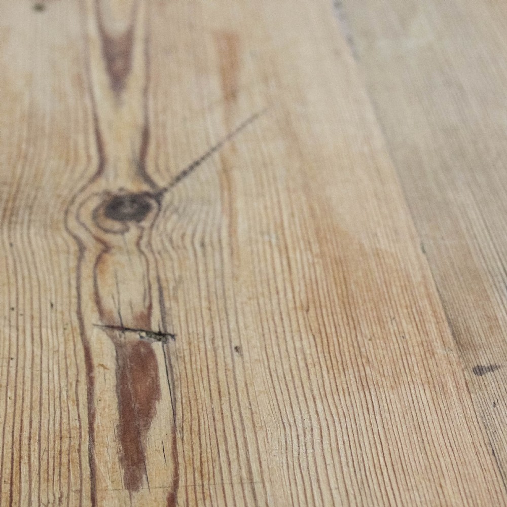 A large antique pine farmhouse kitchen table featuring a plank top, turned legs, and a single frieze drawer with a wooden knob. View XI
