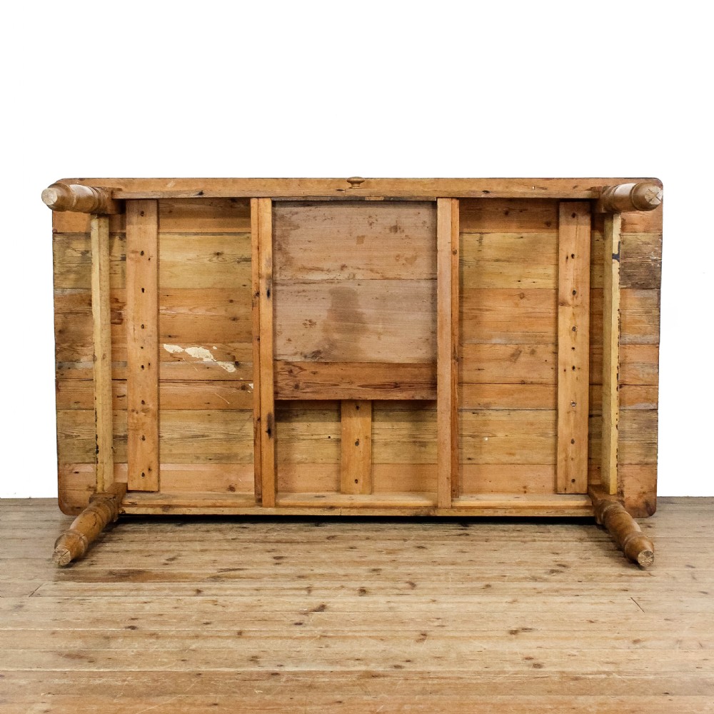 A large antique pine farmhouse kitchen table featuring a plank top, turned legs, and a single frieze drawer with a wooden knob. View XVIII