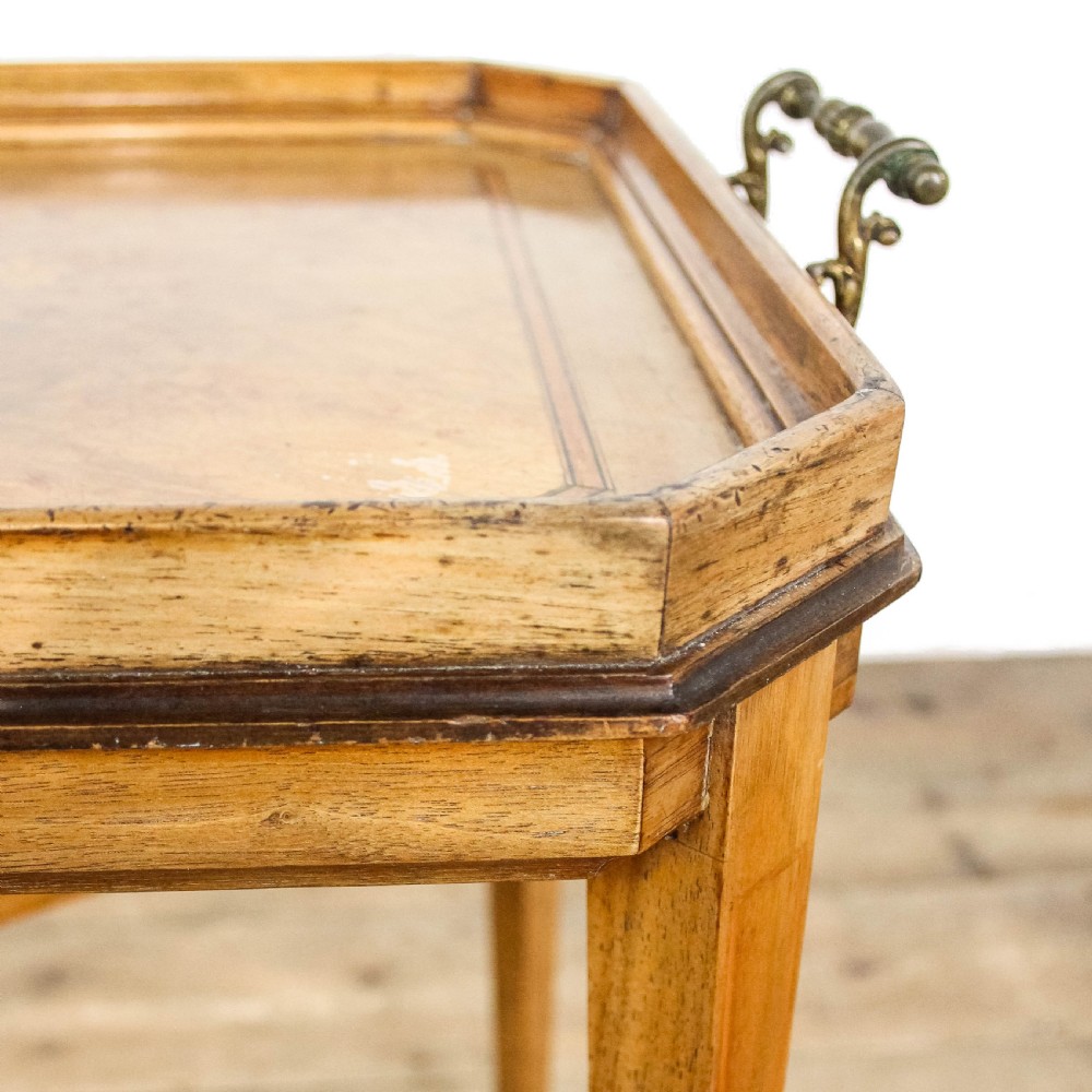 An antique rectangular wooden side table featuring a floral marquetry top tray with raised gallery edges, brass side handles, and slender tapered legs. View VII