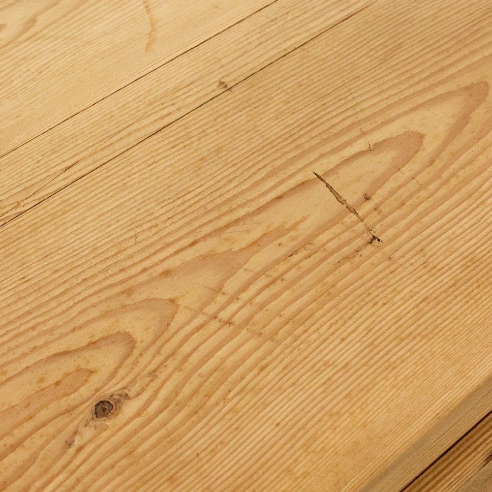 A natural pine storage trunk featuring a gently domed top lid, exposed dovetail corner joints, and a central circular brass escutcheon. View III