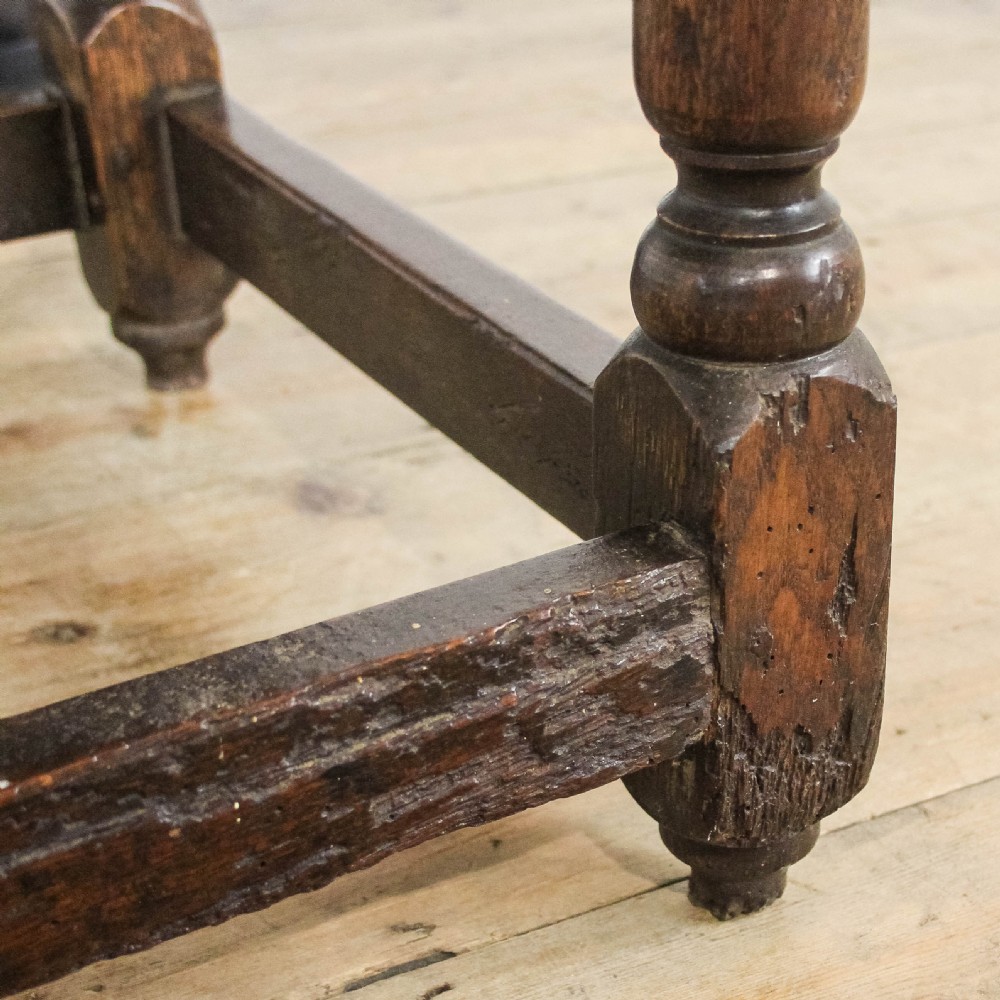 An 18th-century oak side table featuring a rectangular top, a single frieze drawer, four baluster-turned legs, and low box stretchers. View III