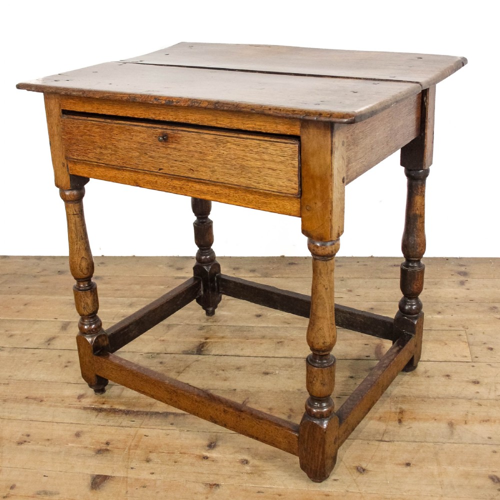An 18th-century oak side table featuring a rectangular top, a single frieze drawer, four baluster-turned legs, and low box stretchers. View VII
