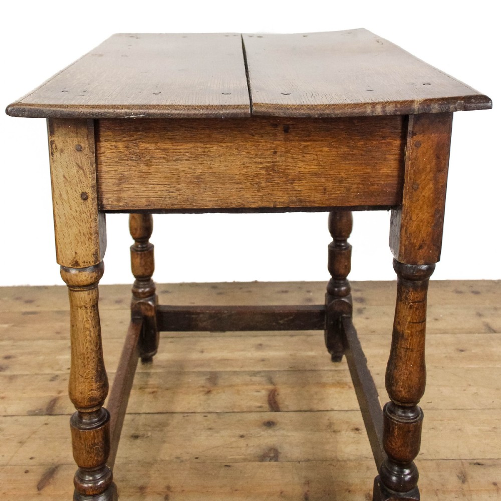 An 18th-century oak side table featuring a rectangular top, a single frieze drawer, four baluster-turned legs, and low box stretchers. View VIII