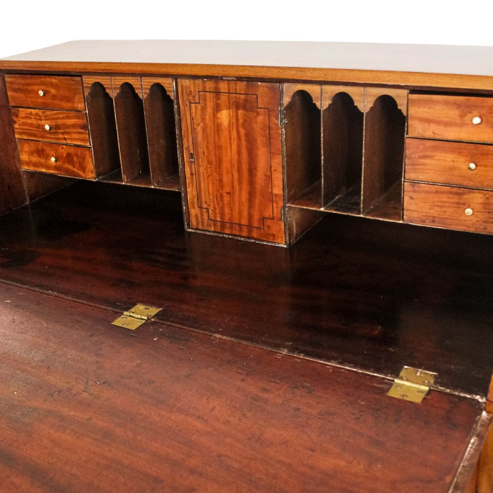 An antique walnut writing bureau featuring a sloping front lid, brass handles, crossbanded inlay borders, and four graduated drawers. View XII