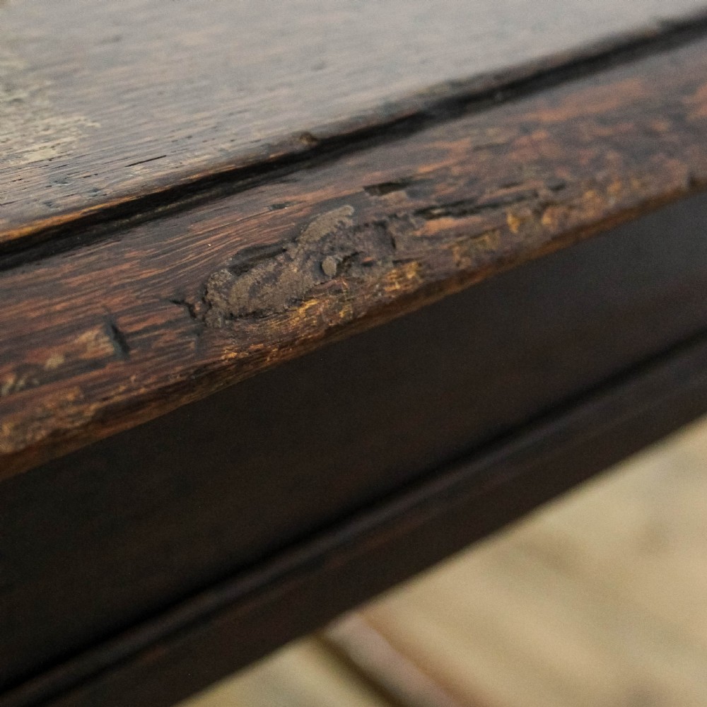 A square dark oak joint stool featuring turned legs, peg joinery, and a low perimeter box stretcher. View VIII