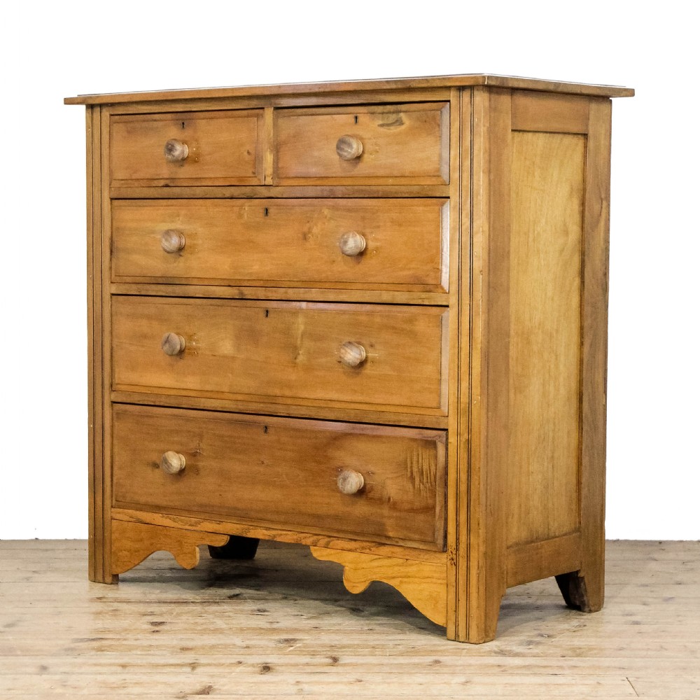 An antique satinwood chest of drawers with two short drawers over three long graduated drawers fitted with turned wooden handles. View II