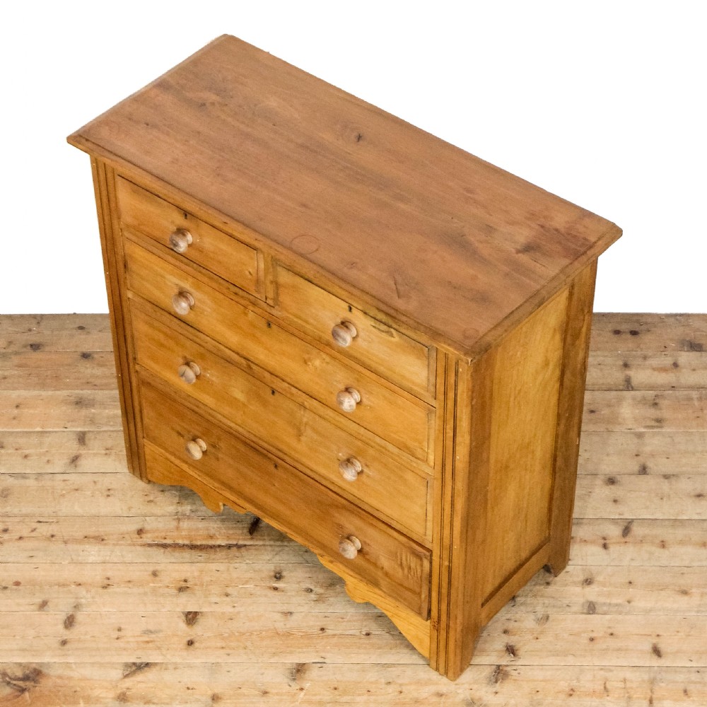 An antique satinwood chest of drawers with two short drawers over three long graduated drawers fitted with turned wooden handles. View III