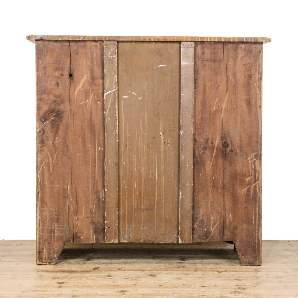 An antique satinwood chest of drawers with two short drawers over three long graduated drawers fitted with turned wooden handles. View IV