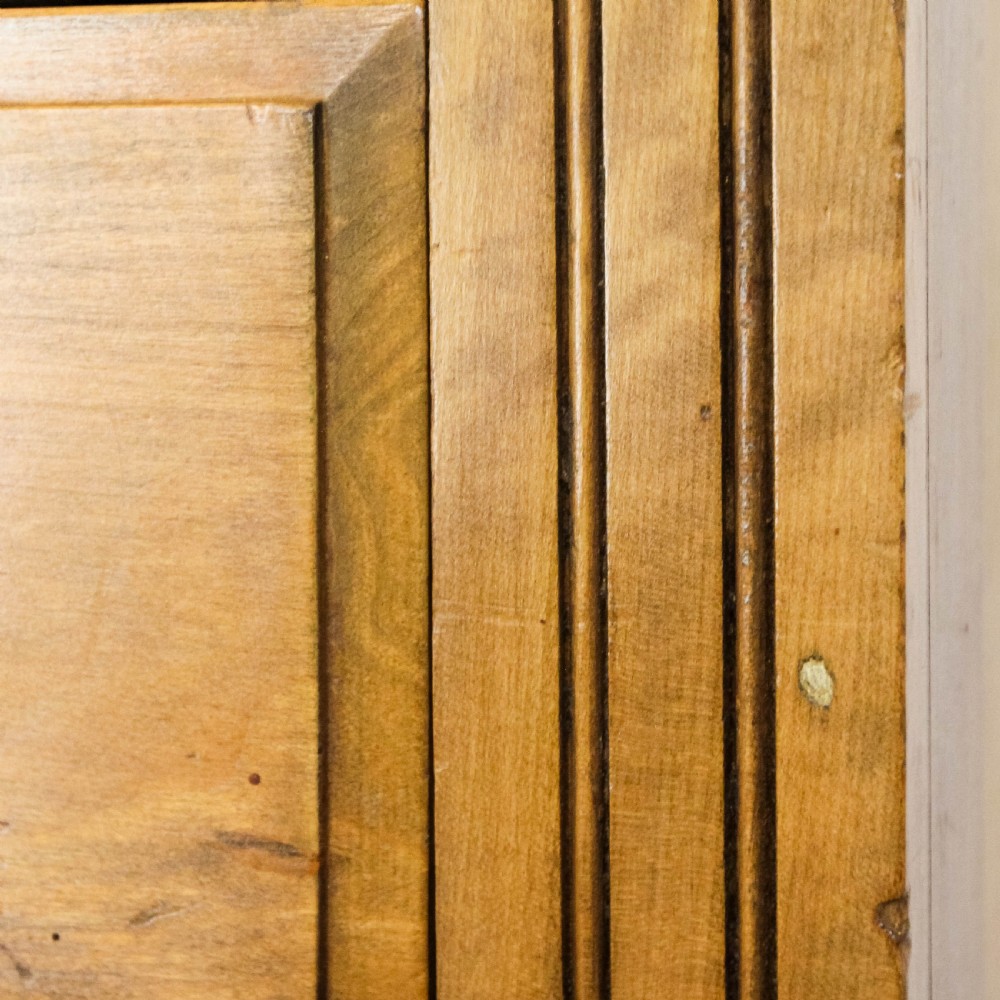 An antique satinwood chest of drawers with two short drawers over three long graduated drawers fitted with turned wooden handles. View XII