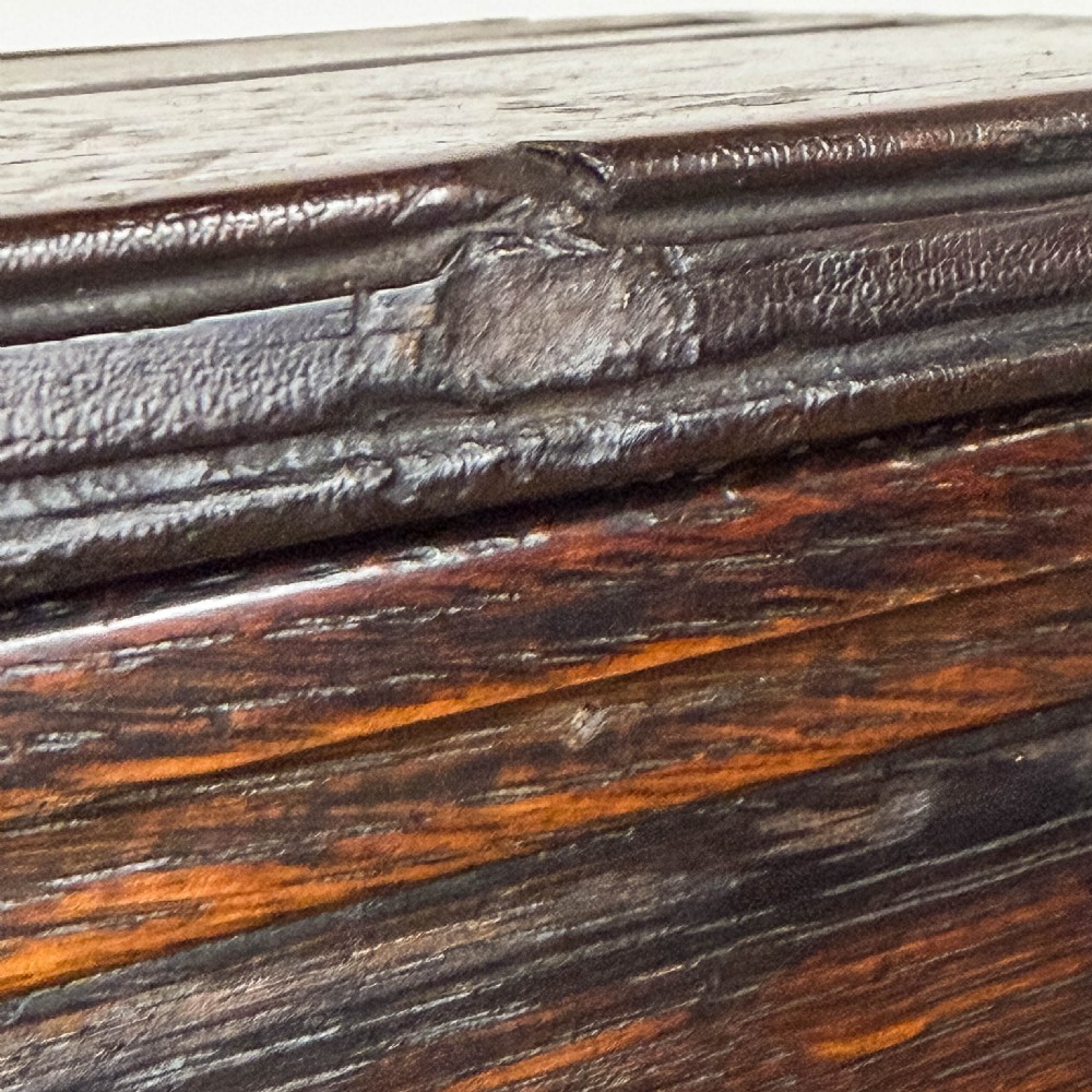 A dark brown oak two-tier wall-hanging shelf unit featuring a scalloped top frieze and vertical planked backboard. View VIII