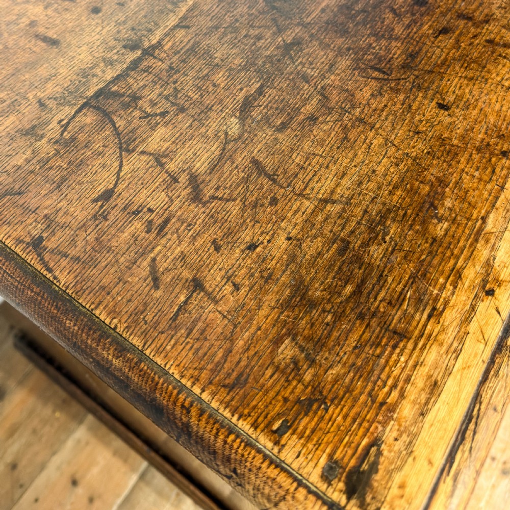 An antique 18th-century oak chest of drawers featuring a two short over three long drawer arrangement, brass handles, and turned bun feet. View XIV