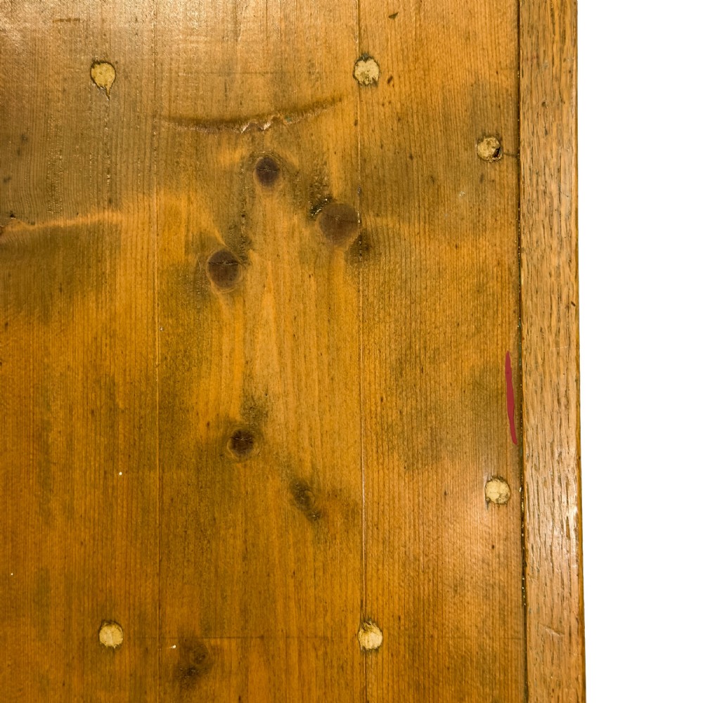An early 20th-century golden oak cupboard featuring upper glazed double doors over lower solid panelled doors with brass hardware. View VIII