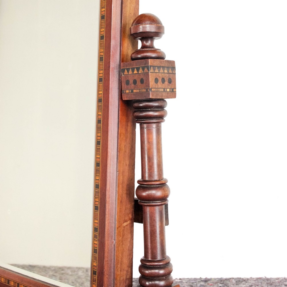 A Victorian Gothic mahogany swing mirror featuring a pointed arch pediment with a trefoil cutout, turned side columns, and geometric inlay borders. View III