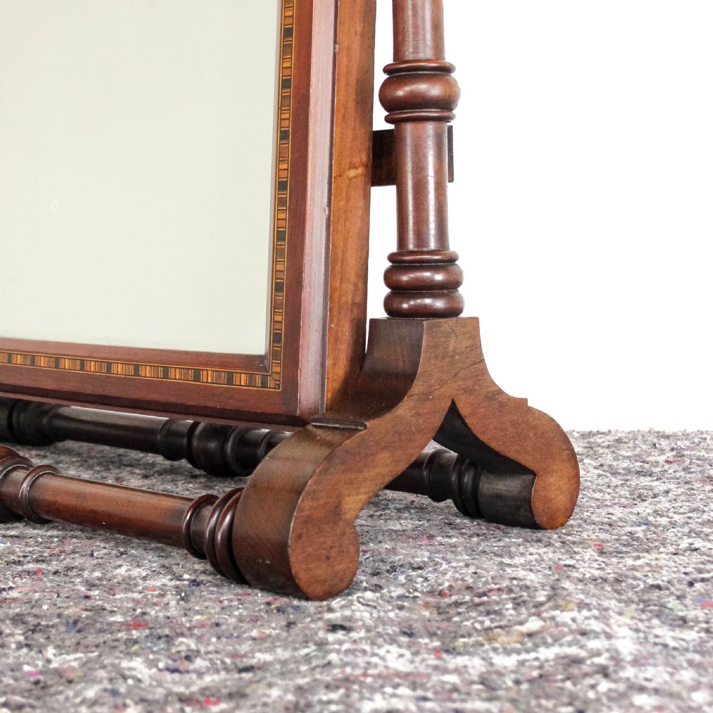 A Victorian Gothic mahogany swing mirror featuring a pointed arch pediment with a trefoil cutout, turned side columns, and geometric inlay borders. View IV
