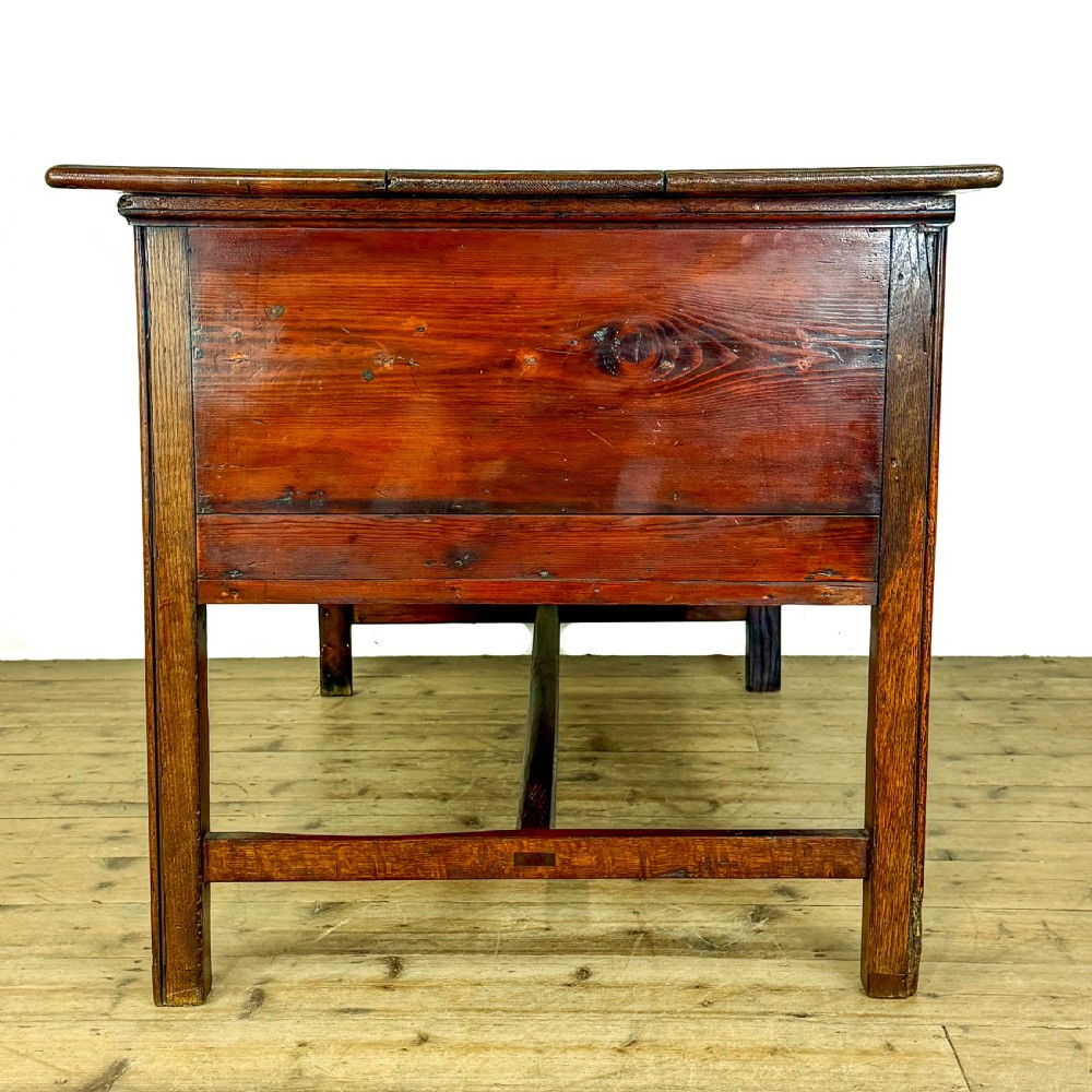 An antique oak serving table featuring brass drop handles, multiple drawer compartments, a scalloped apron, and straight legs connected by stretchers. View VIII