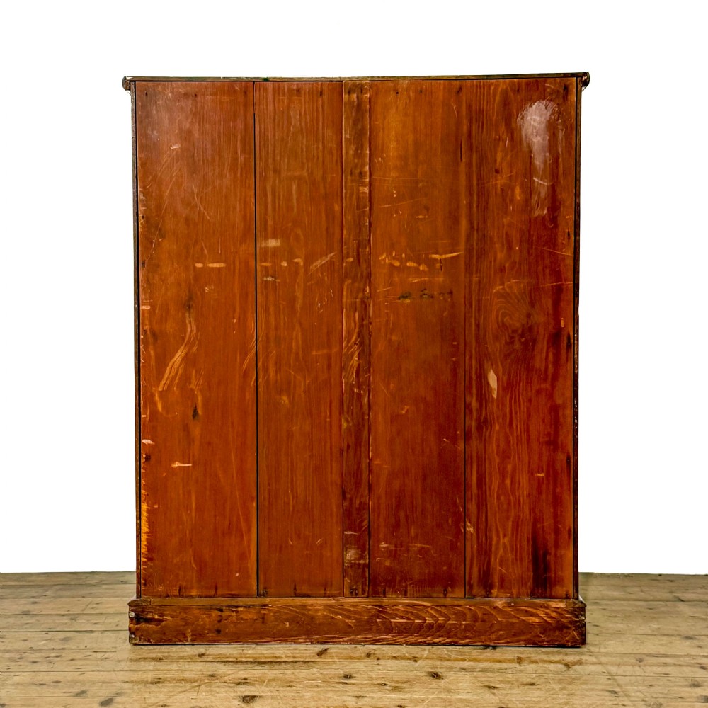 An antique Victorian mahogany tall chest of drawers featuring two short upper drawers above four long lower drawers with turned wooden knobs on a solid plinth base. View V