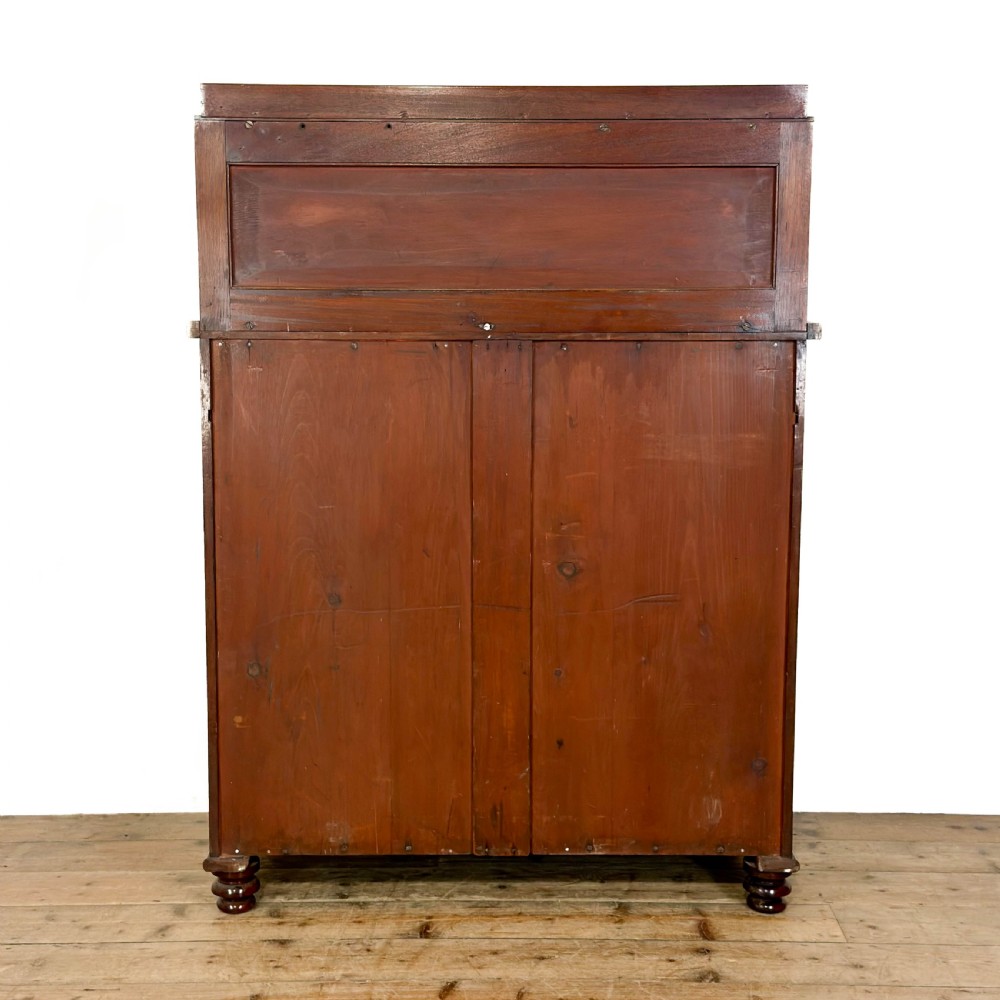 A Victorian mahogany chiffonier sideboard featuring a raised back shelf on turned supports, a frieze drawer with brass hardware, and two arched cupboard doors. View IV