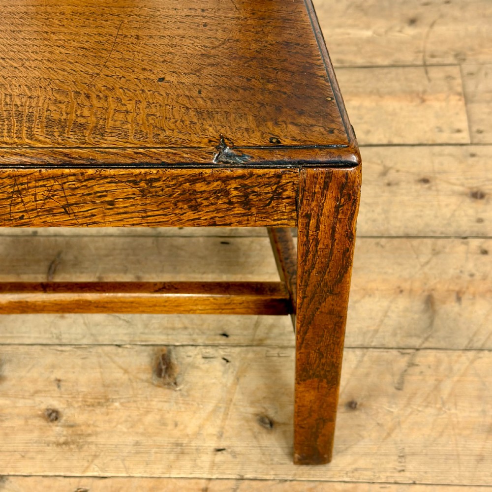 A set of six medium brown antique oak dining chairs featuring vertical splat backs, solid wooden seats, and stretcher bases. View IV