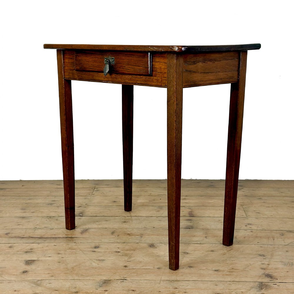 A dark oak rectangular side table featuring a single drawer with a metal drop handle and four straight legs. View II
