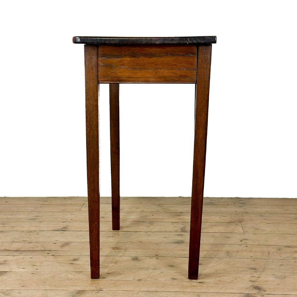 A dark oak rectangular side table featuring a single drawer with a metal drop handle and four straight legs. View III