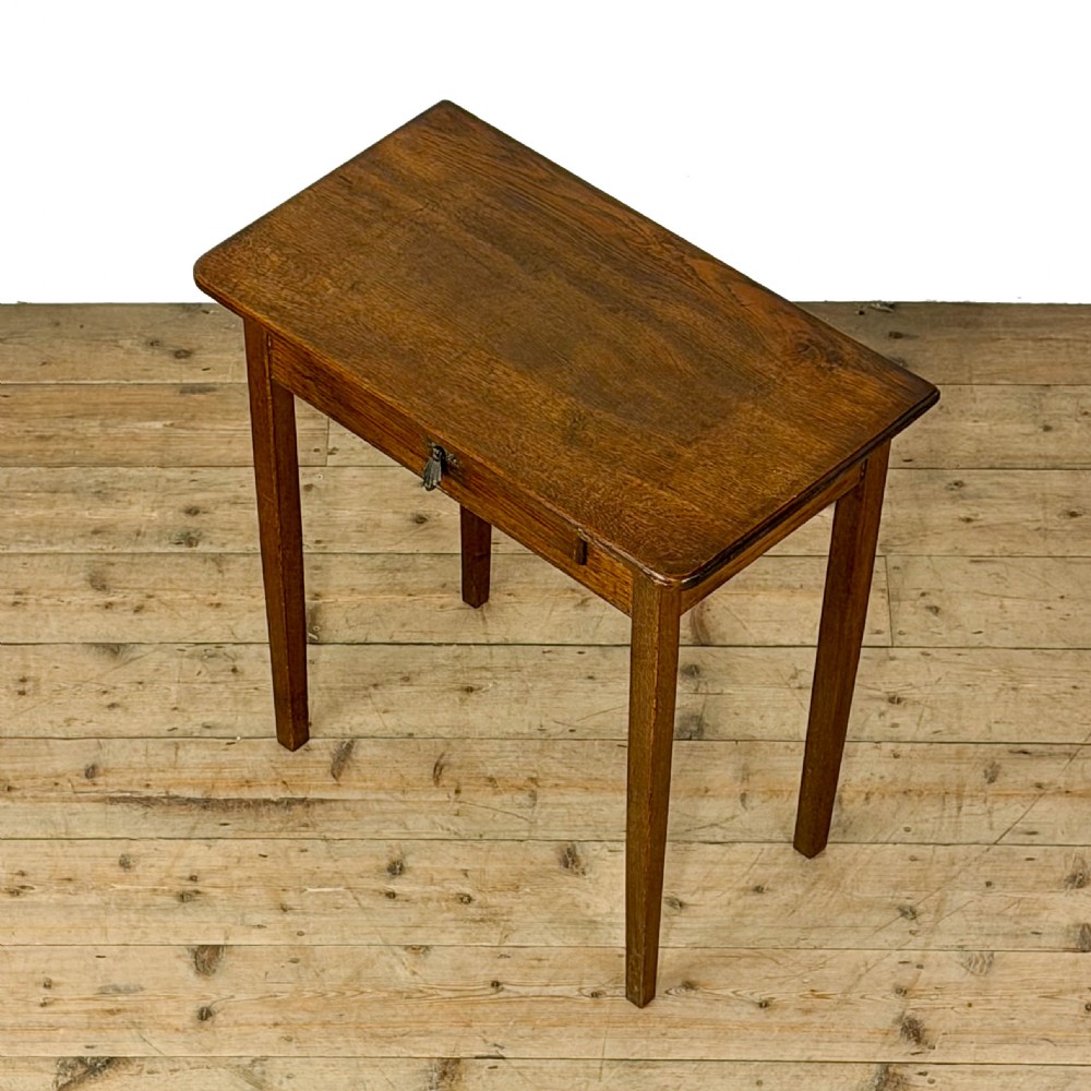 A dark oak rectangular side table featuring a single drawer with a metal drop handle and four straight legs. View IV