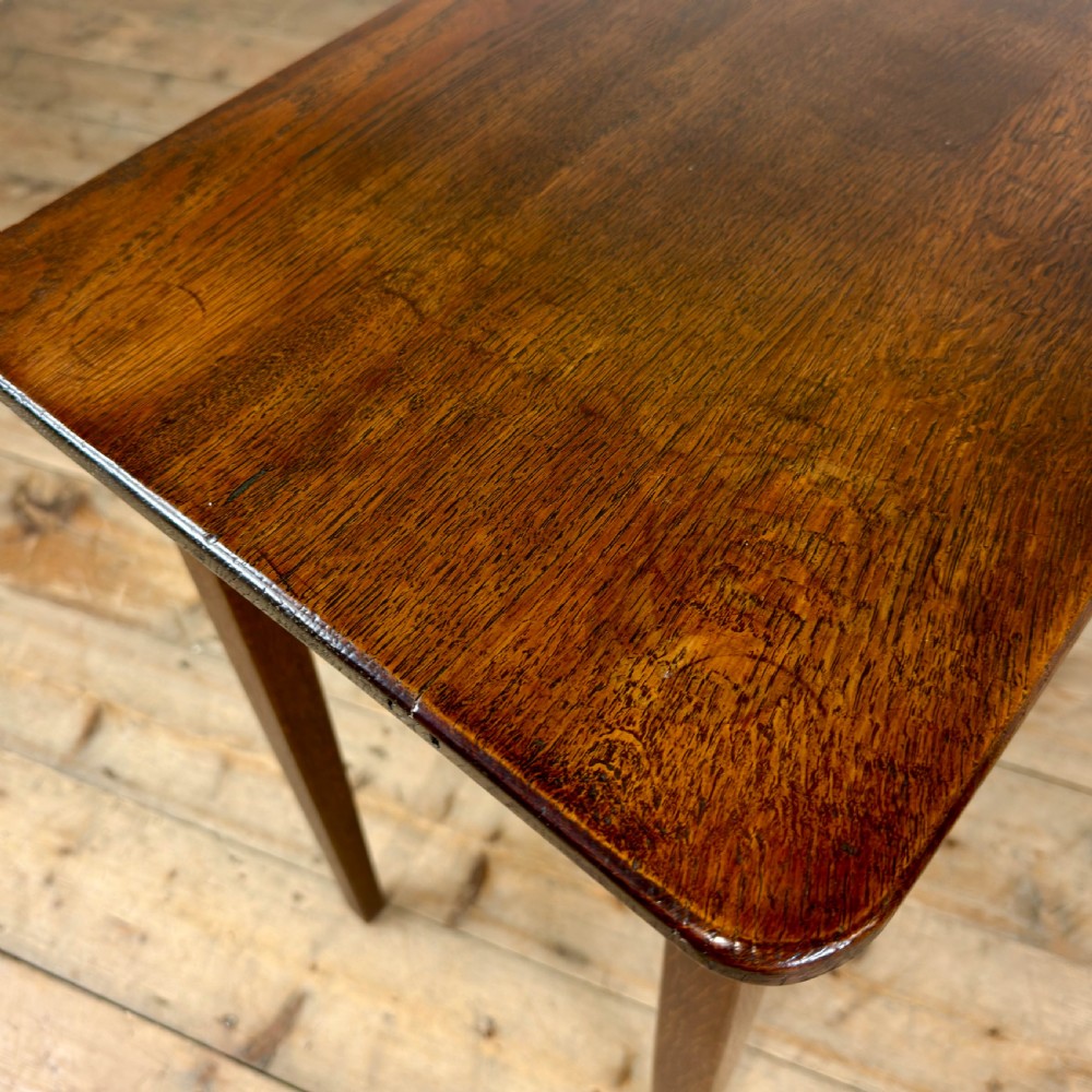 A dark oak rectangular side table featuring a single drawer with a metal drop handle and four straight legs. View VIII