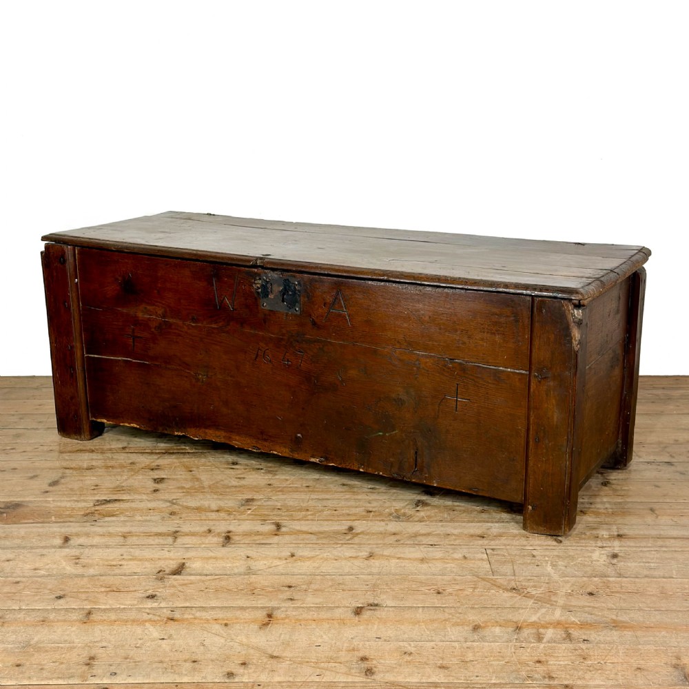 A large dark oak coffer featuring the carved initials W A, the date 1647, two small carved crosses, and a central iron lockplate. View V