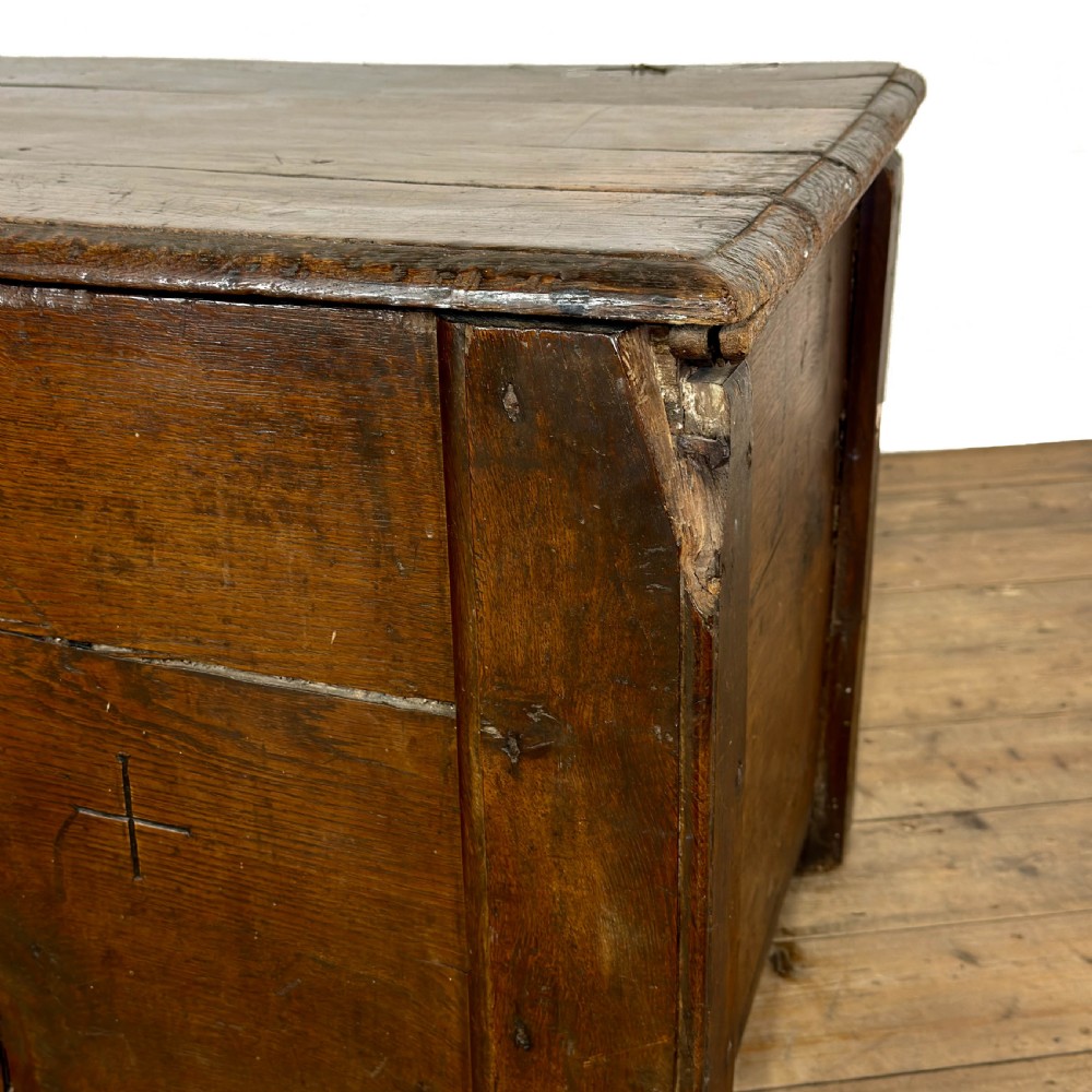 A large dark oak coffer featuring the carved initials W A, the date 1647, two small carved crosses, and a central iron lockplate. View VII
