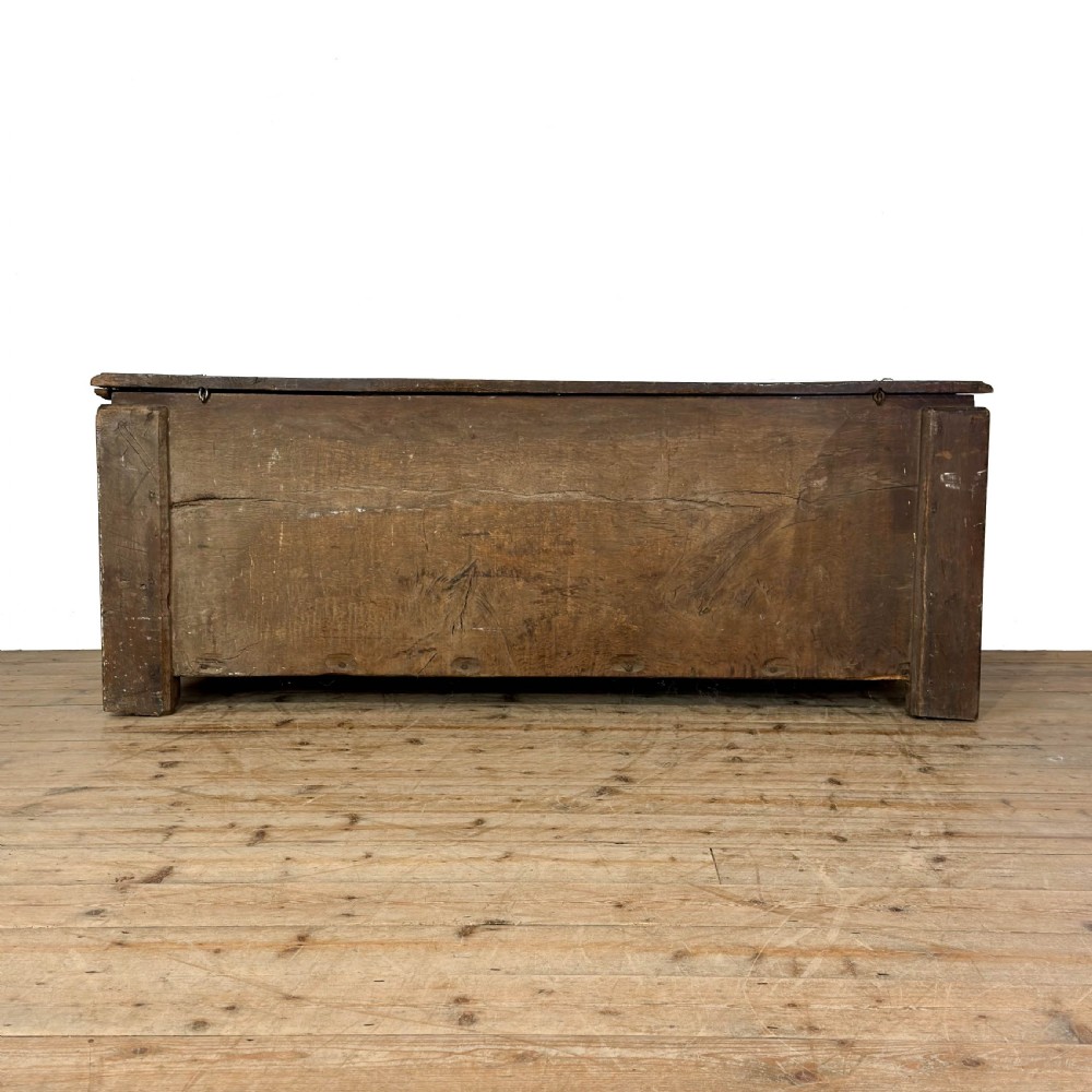 A large dark oak coffer featuring the carved initials W A, the date 1647, two small carved crosses, and a central iron lockplate. View X