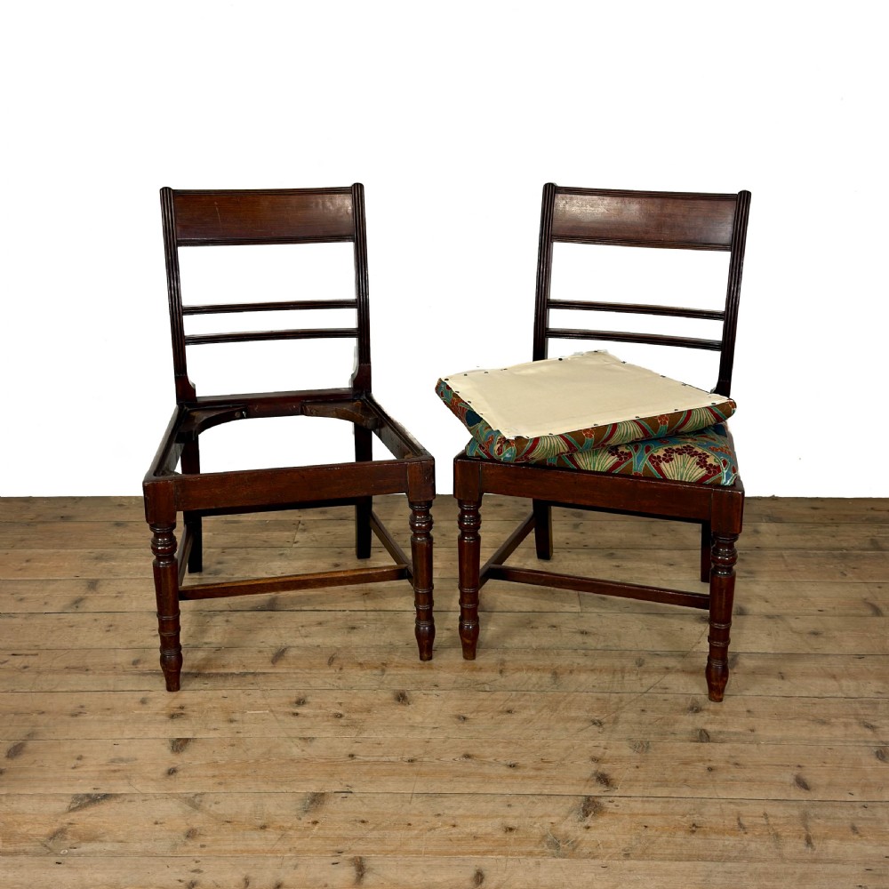 Set of four antique mahogany dining chairs with horizontal bar backs, turned front legs, and patterned drop-in upholstered seats. View III