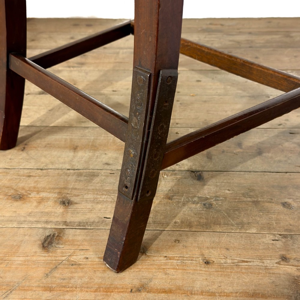 Set of four antique mahogany dining chairs with horizontal bar backs, turned front legs, and patterned drop-in upholstered seats. View IX