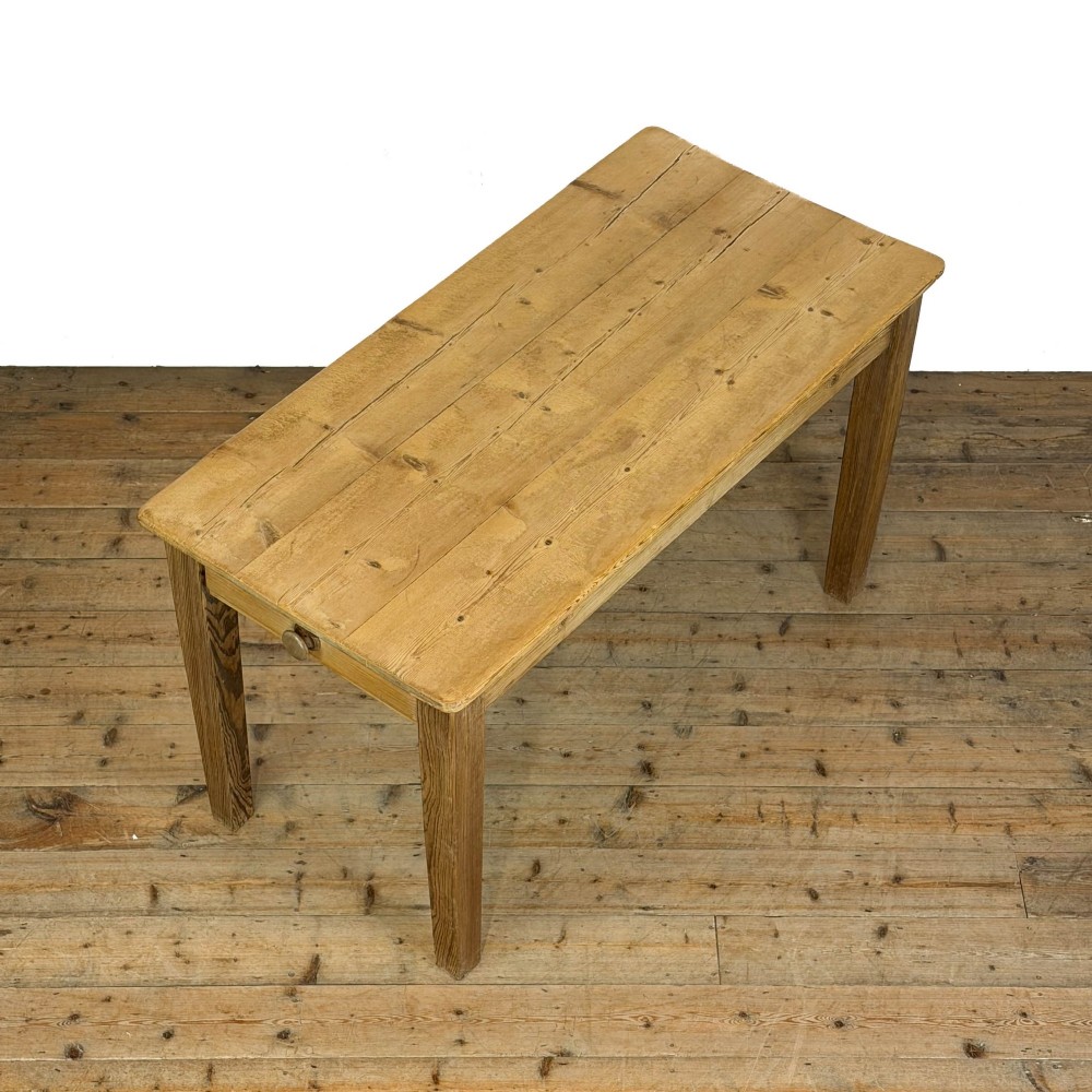 A rustic pine kitchen table featuring a single frieze drawer with a round wooden knob handle and four straight legs. View III