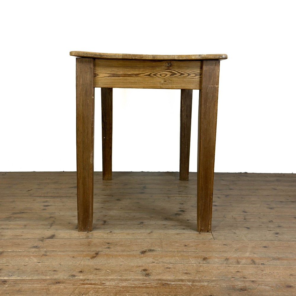 A rustic pine kitchen table featuring a single frieze drawer with a round wooden knob handle and four straight legs. View IV